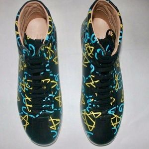 Stylish Black High-Top Sneakers with Blue and Yellow Accents